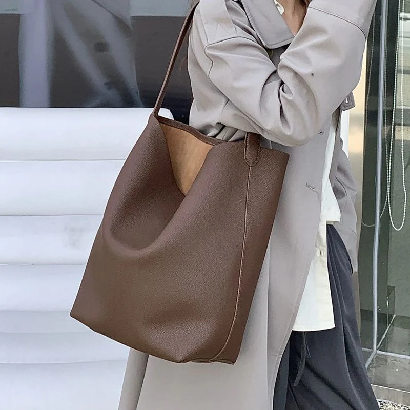 Drawstring Leather Bucket Bag — Drawstring split-leather bucket bag with a top handle and shoulder strap, in coffee, gold-brown, off-white, black, brick red, wine red, elephant grey and rice-apricot