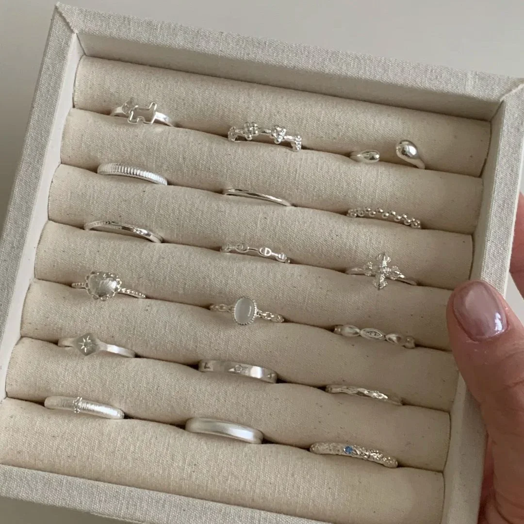 Sterling Silver Band Collection — Tray of fine S925 sterling silver stacking bands in eighteen styles