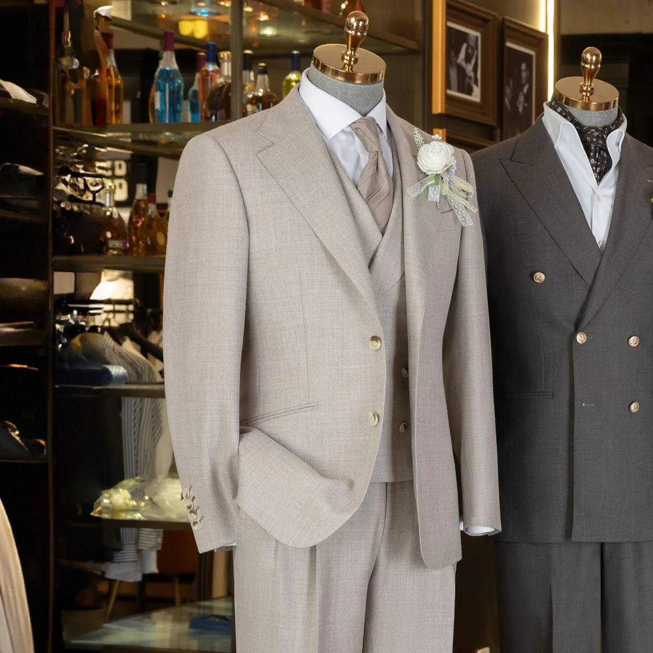 Three-Piece Wool Suit — Light grey three-piece wool suit with waistcoat displayed on a tailor’s mannequin