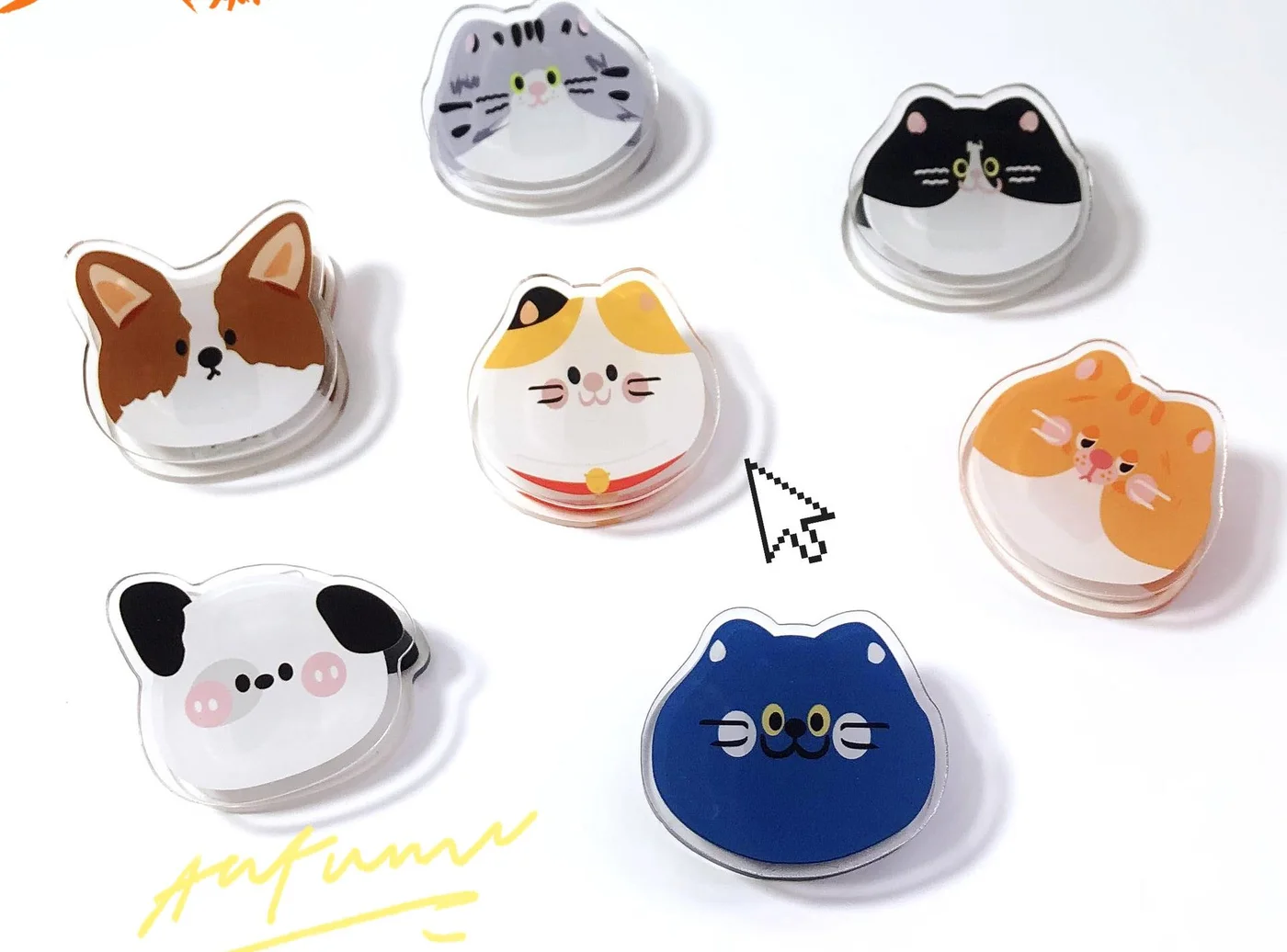 Cat Face Acrylic Charm — Flat-lay of original cartoon acrylic cat and dog face charms in six colours